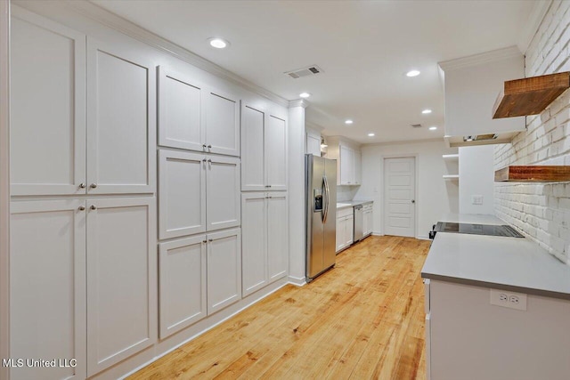 102 Holly Trl, Brandon, MS 39047 - kitchen featuring open shelves, appliances with stainless steel finishes, light wood-style flooring, recessed lighting, and light countertops