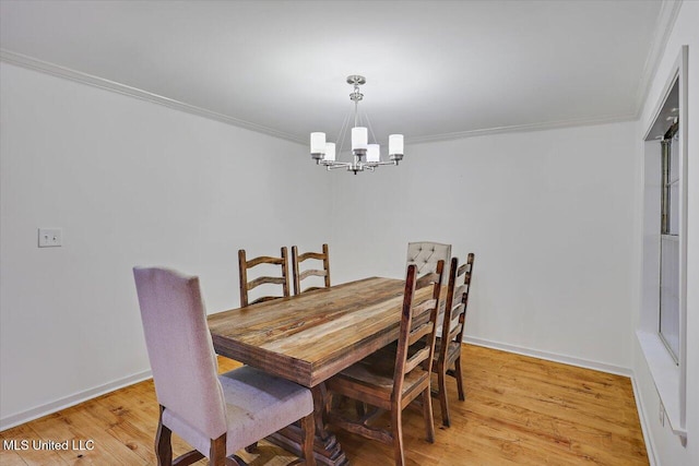 102 Holly Trl, Brandon, MS 39047 - dining area with a chandelier, crown molding, light wood-style floors, and baseboards