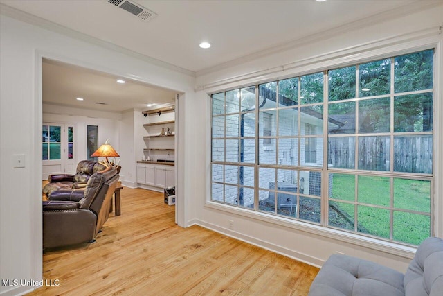 102 Holly Trl, Brandon, MS 39047 - living area with ornamental molding, light wood finished floors, plenty of natural light, recessed lighting, and baseboards
