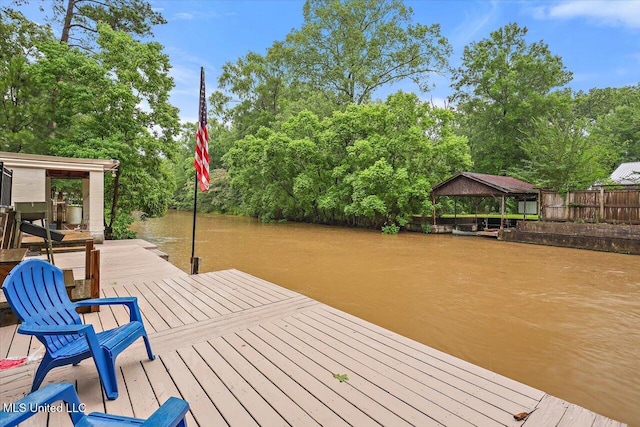 102 Holly Trl, Brandon, MS 39047 - dock featuring a gazebo, view of scattered trees, and a water view