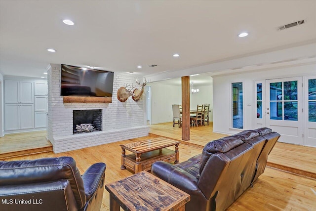 102 Holly Trl, Brandon, MS 39047 - living area with light wood finished floors, recessed lighting, and a brick fireplace