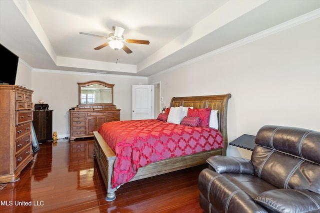 7637 Wisteria Dr, Olive Branch, MS 38654 - bedroom featuring dark wood-style flooring, ornamental molding, a raised ceiling, and a ceiling fan