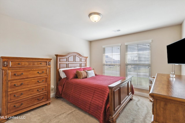 7637 Wisteria Dr, Olive Branch, MS 38654 - bedroom featuring visible vents, baseboards, and light colored carpet