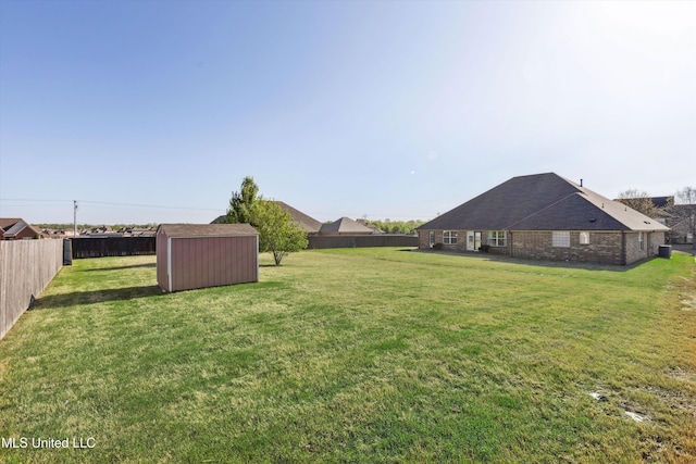7637 Wisteria Dr, Olive Branch, MS 38654 - view of yard featuring an outbuilding, a fenced backyard, and a shed