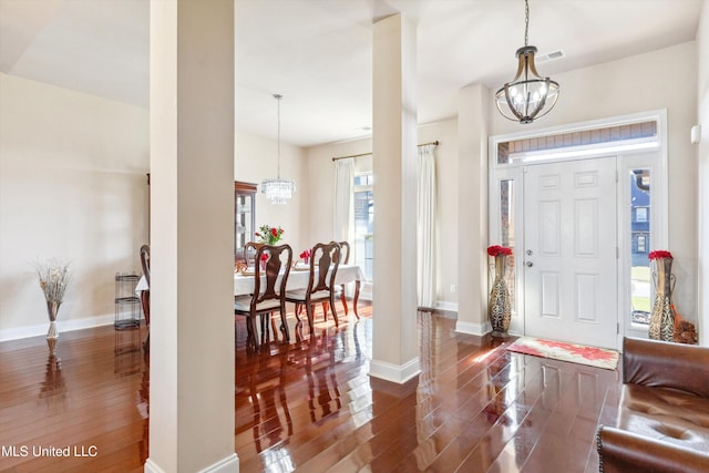7637 Wisteria Dr, Olive Branch, MS 38654 - foyer entrance with a chandelier, baseboards, dark wood-style floors, and visible vents