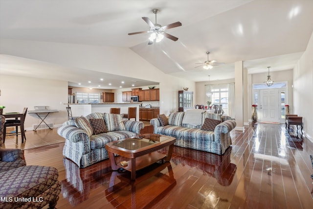 7637 Wisteria Dr, Olive Branch, MS 38654 - living area featuring ceiling fan, baseboards, vaulted ceiling, and wood finished floors