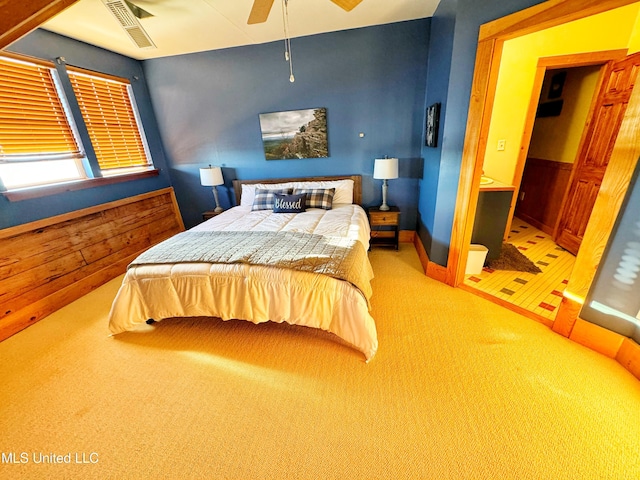 carpeted bedroom with ceiling fan