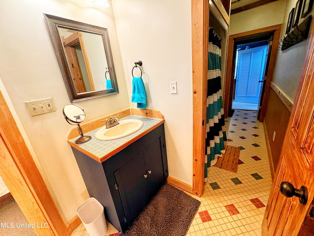 bathroom with vanity and a shower with shower curtain