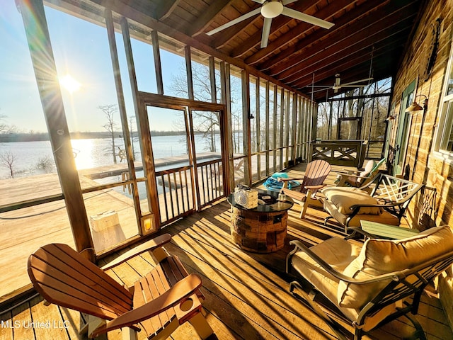 sunroom / solarium featuring a water view, wood ceiling, and ceiling fan