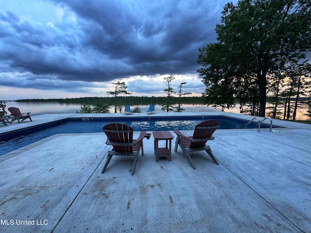 view of pool with a water view