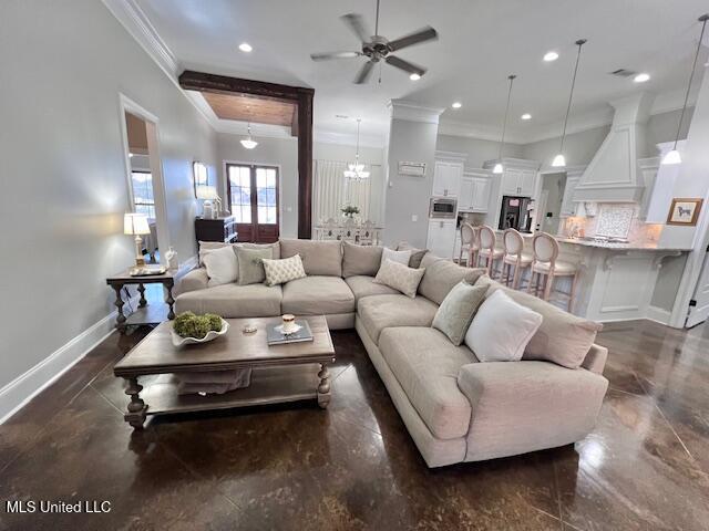 living room with ornamental molding and ceiling fan