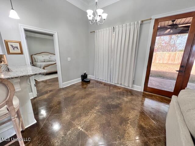 dining area featuring ceiling fan with notable chandelier and ornamental molding