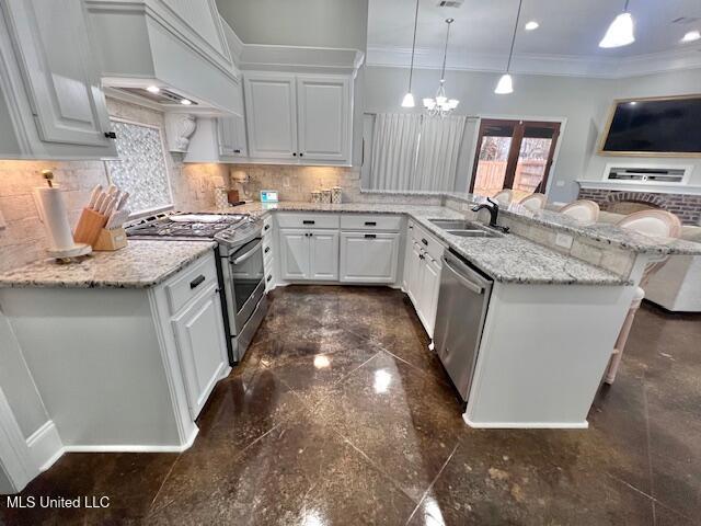 kitchen featuring white cabinetry, sink, a kitchen breakfast bar, custom exhaust hood, and stainless steel appliances