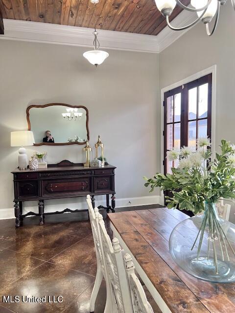 dining space featuring an inviting chandelier, wood ceiling, and crown molding