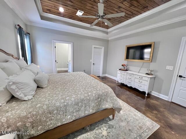 bedroom featuring a tray ceiling, ornamental molding, wooden ceiling, and ceiling fan