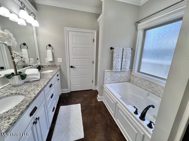 bathroom featuring hardwood / wood-style flooring, vanity, a tub, and crown molding