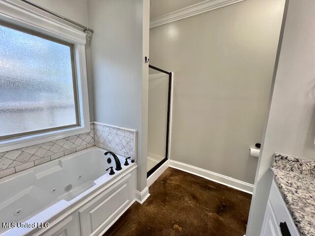 bathroom with ornamental molding, plenty of natural light, shower with separate bathtub, and vanity