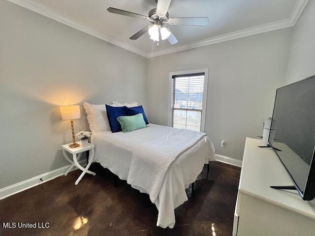 bedroom with ornamental molding and ceiling fan