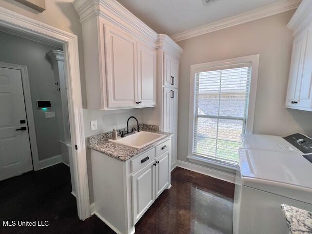 kitchen featuring sink, white cabinetry, separate washer and dryer, dark hardwood / wood-style flooring, and light stone countertops