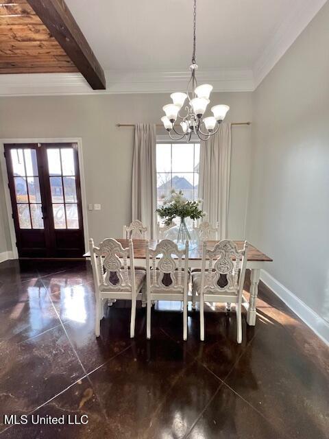 unfurnished dining area featuring ornamental molding, a chandelier, beam ceiling, and french doors