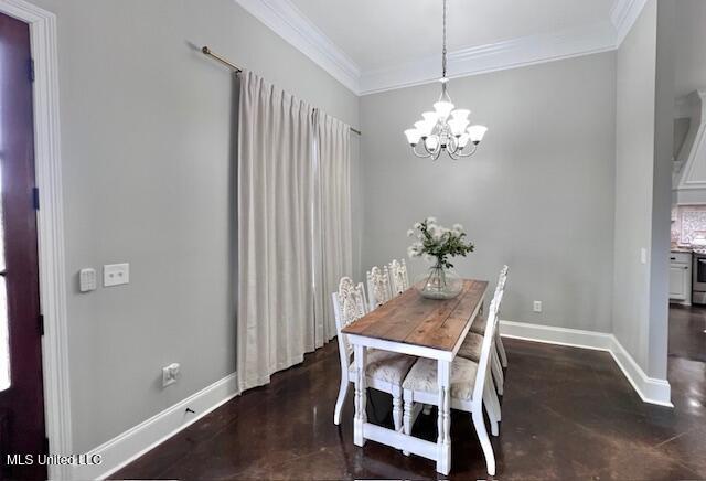 dining area with crown molding and a chandelier