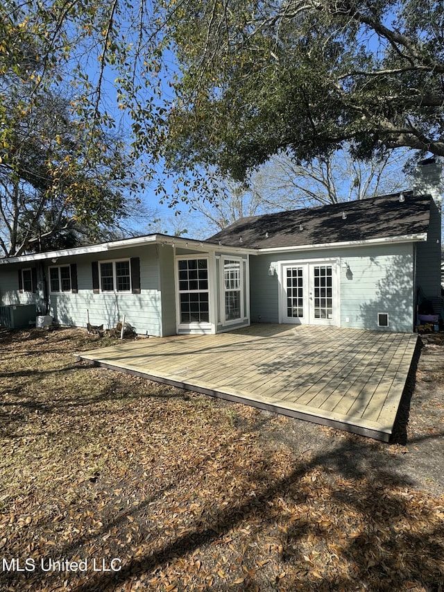 back of property with french doors and a wooden deck