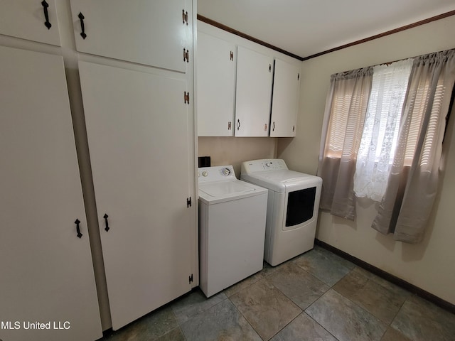 166 Lee Ave, Vidalia, LA 71373 - clothes washing area with washer and dryer, cabinet space, baseboards, and light stone finish floors