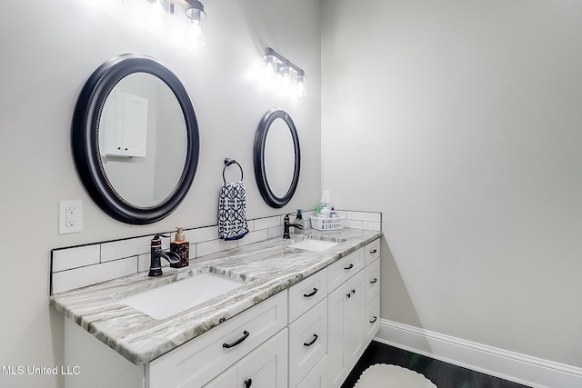 bathroom with vanity and wood-type flooring