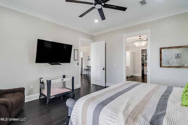 bedroom featuring crown molding, dark hardwood / wood-style flooring, and ceiling fan with notable chandelier