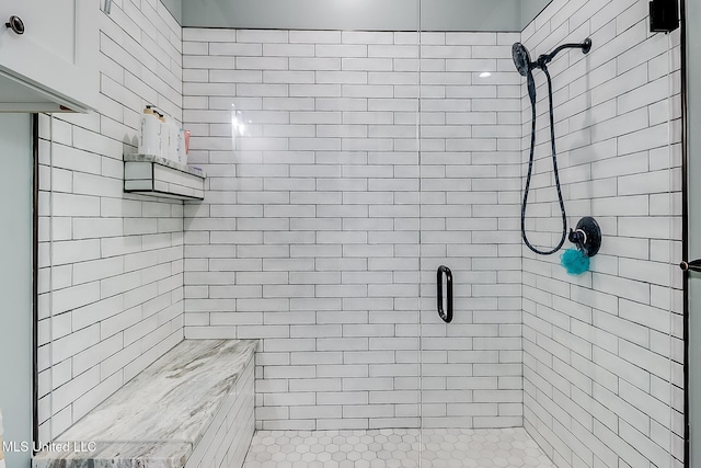 bathroom with a shower with shower door