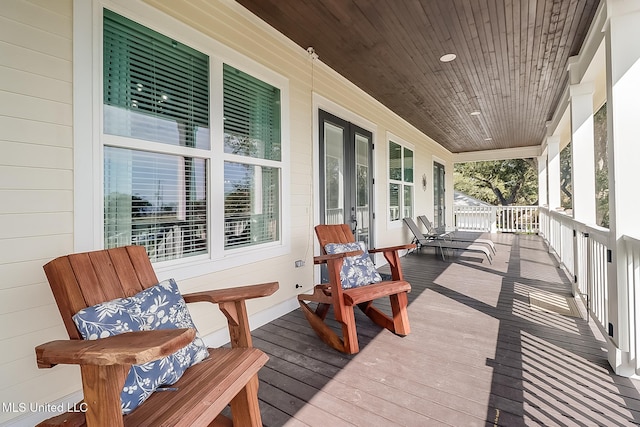 wooden deck featuring covered porch