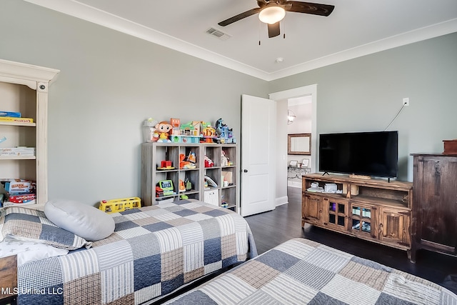 bedroom with crown molding, dark hardwood / wood-style floors, and ceiling fan