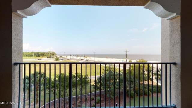 balcony featuring a water view