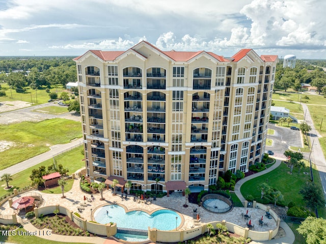 view of property featuring a community pool