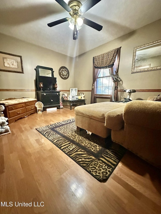 bedroom featuring hardwood / wood-style floors and ceiling fan