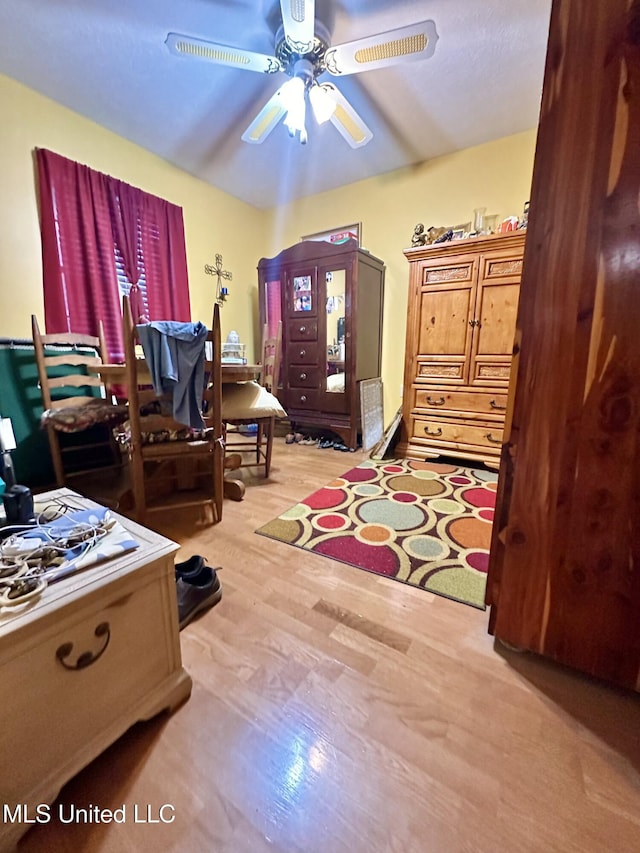 bedroom featuring light wood-type flooring and ceiling fan