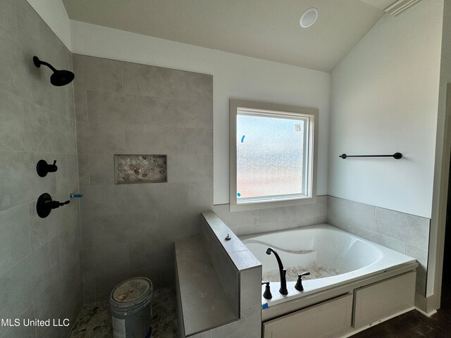 bathroom with separate shower and tub