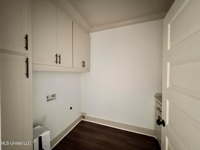 laundry room featuring dark wood-type flooring, cabinets, washer hookup, and electric dryer hookup