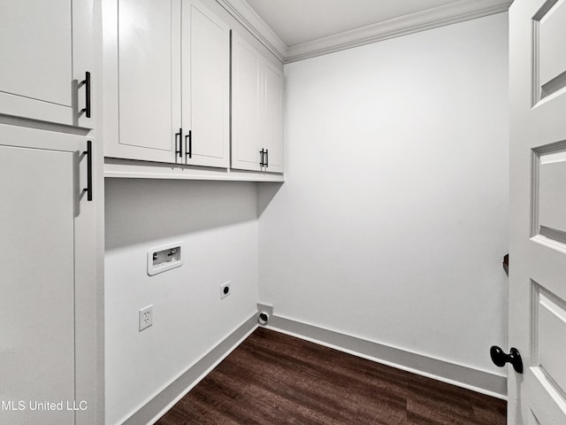 laundry area featuring cabinets, ornamental molding, washer hookup, dark wood-type flooring, and hookup for an electric dryer