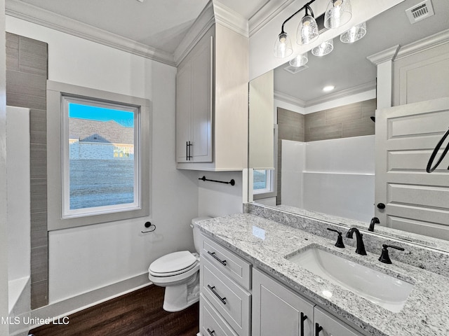 bathroom featuring ornamental molding, toilet, hardwood / wood-style floors, and vanity