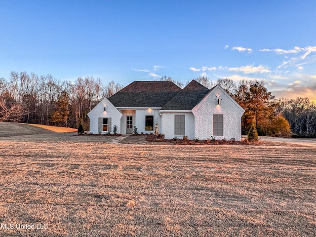 view of front of house with a lawn