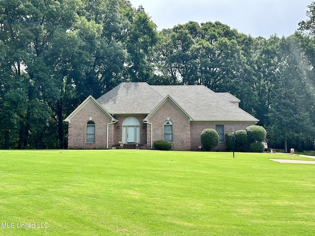 8136 Saddlebrook Cv, Olive Branch, MS 38654 - view of front of house featuring a front lawn and brick siding