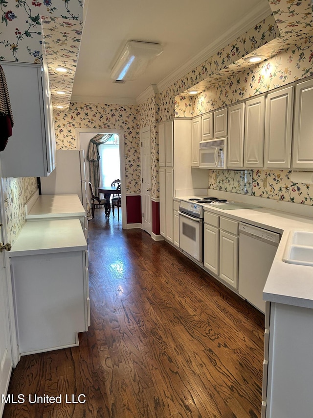 8136 Saddlebrook Cv, Olive Branch, MS 38654 - kitchen with wallpapered walls, white appliances, ornamental molding, light countertops, and dark wood-style flooring