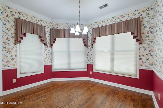 8136 Saddlebrook Cv, Olive Branch, MS 38654 - unfurnished dining area featuring a chandelier, wood finished floors, wallpapered walls, and ornamental molding