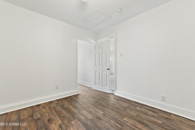 spare room featuring dark hardwood / wood-style floors