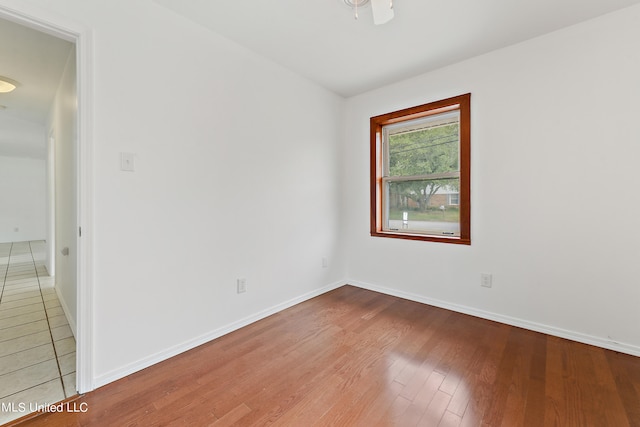 empty room featuring hardwood / wood-style floors and ceiling fan