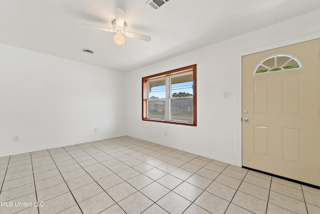 tiled foyer entrance featuring ceiling fan