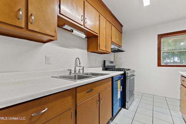 kitchen featuring sink, stainless steel range with gas cooktop, and light tile patterned floors