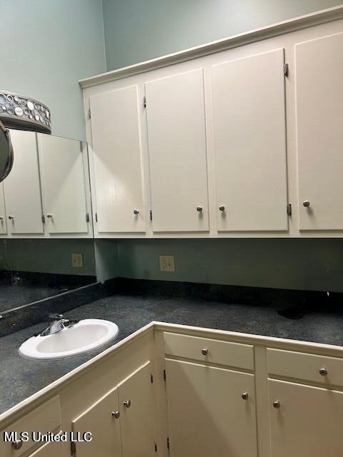 clothes washing area featuring a sink