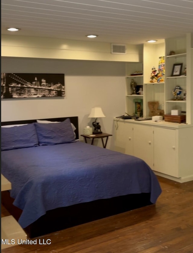 bedroom featuring visible vents, recessed lighting, and wood finished floors